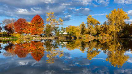 Fall color reflection on a peacefully calm lake Denver, Colorado