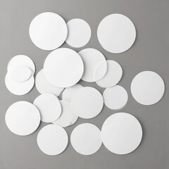 Set of blank round adhesive paper stickers in various sizes on a white background, craft projects, gift wrapping, packaging design