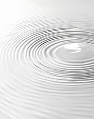 Abstract grayscale image of concentric ripples spreading on a liquid surface.