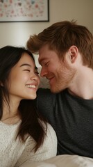 Obraz premium Mixed couple, asian woman and white man smiling at each other in bed. Vertical photography (9:16)