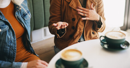 Hands, women and talking at cafe with coffee, friendly catchup and morning gossip of social break. People, friends and discussion with warm beverage for hangout reunion, chatting and bonding together