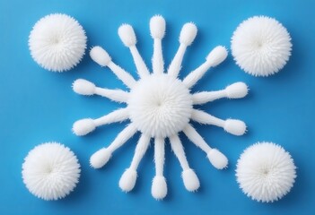 White floral-like abstract formation of cotton swabs arranged in a radial design on a vibrant blue background.