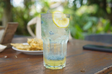 Glass of fresh lemonade squash with basil seed drink
