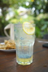 Glass of fresh lemonade squash with basil seed drink