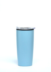 Blue hot drink tumbler or thermos isolated on a white background. Hot water bottle for lunch. Copy space for text. For graphic design or banner background. Plain bottle for mockup design