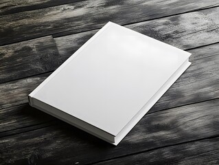 Blank white hardcover book on rustic wooden table, top view