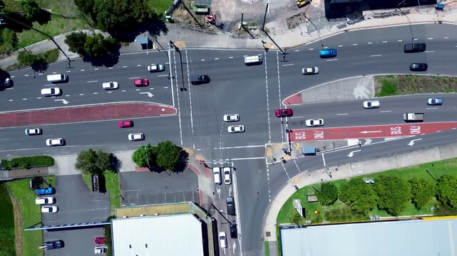 Drone aerial landscape of car vehicles traffic transport at stoplight intersection of Tuggerah main road street Central Coast Australia urban infrastructure travel tourism neighbourhood