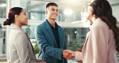 Handshake, meeting and happy business people in office for teamwork, collaboration and partnership. Corporate, professional and men and women shaking hands for promotion, agreement and thank you © peopleimages.com
