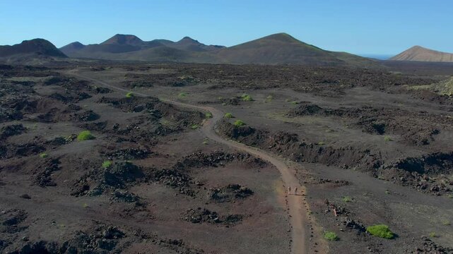 Aerial drone view of mountain sea and volcanoes in Lanzarote, Canary Islands, Spain