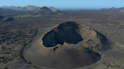 Aerial drone view of mountain sea and volcanoes in Lanzarote, Canary Islands, Spain