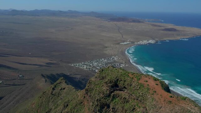 Aerial drone view of mountain sea and volcanoes in Lanzarote, Canary Islands, Spain