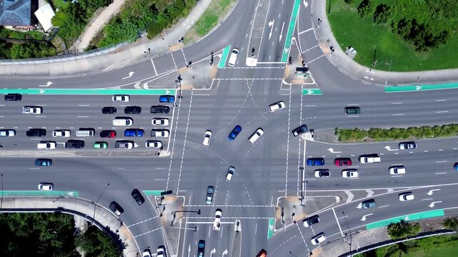 Drone aerial landscape of car vehicles traffic and transport driving on intersection traffic lights roads street of Tuggerah Central Coast Australia streetlight crossing urban infrastructure