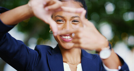 Portrait, corporate and woman for finger frame in city of business photography, profile picture and ambition. Smile, hand gesture and perspective for morning commute, career experience and accountant © Robertson/peopleimages.com