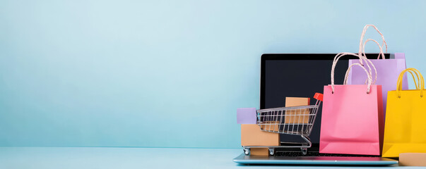 A laptop sits on a blue background with a shopping cart