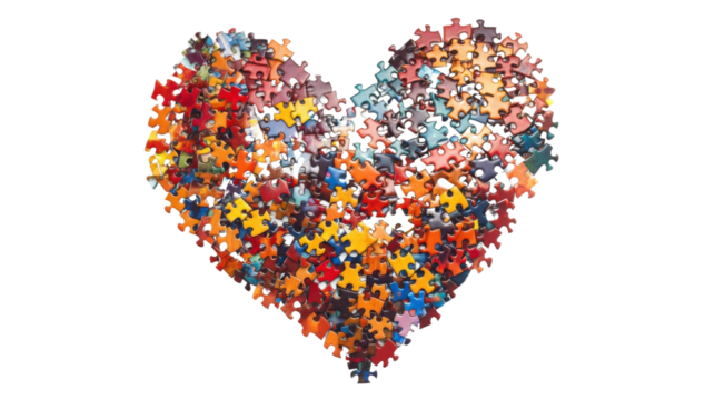 Colorful puzzle pieces forming a heart shape on transparent background