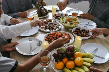Close-up Few Hands Taking Food Together On Eid Mubarak Moment. Family Togetherness Concept For Eid. 