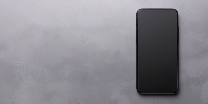 A sleek black smartphone is placed on a textured gray surface, showcasing a minimalist design and modern aesthetic.