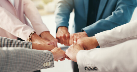 Fist, huddle and team building with business people in office together for solidarity or unity....