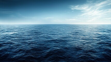 Obraz premium Vast ocean under a blue sky creates a serene and tranquil atmosphere.