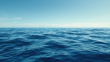 Fototapeta premium Vast blue ocean under a clear sky with gentle waves.