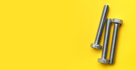 Tap bolts on yellow background