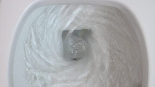The flushing process in the toilet bowl, top view