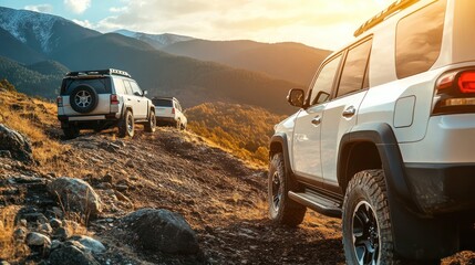 Obraz premium Rugged personal car hire service for adventure seekers, featuring off-road vehicles parked near a mountainous trail