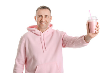 Mature man with glass of fruit smoothie on white background