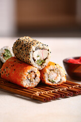 Tasty sushi rolls  on table