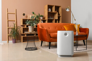 Fototapeta premium Interior of modern living room with air purifier and brown sofa