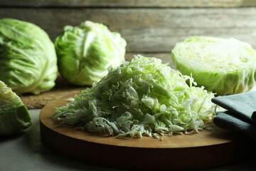 Fresh shredded cabbage on light table, closeup
