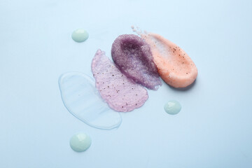 Samples of cosmetic products on light blue background. Skin care