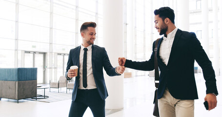 Business, men and fist bump greeting in office for work arrival, goal achievement or job promotion success. Friends, employees and support with company bonus, congratulations and pride for colleague