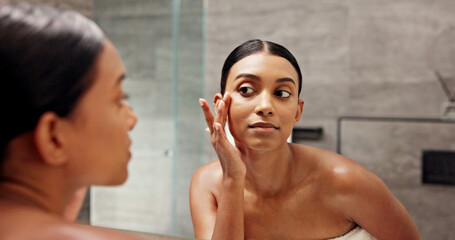 Bathroom, mirror and woman with check for skincare, self care and face inspection with glow in morning. Home, reflection and female person with beauty for cosmetics, acne treatment or hygiene routine