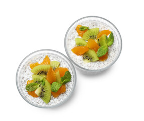 Delicious chia pudding with kiwi, peach and mint in glasses isolated on white, top view