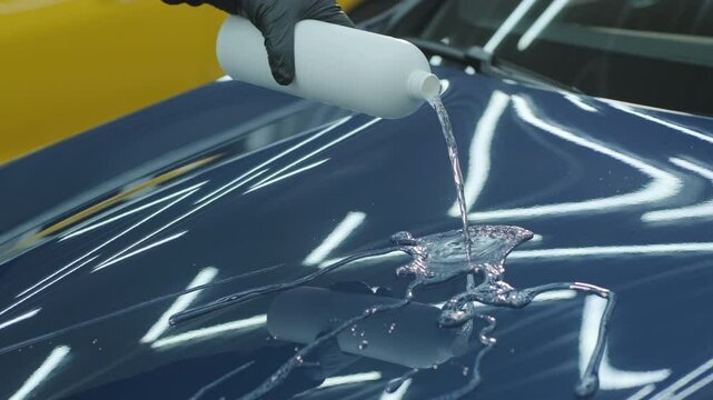 Water-repellent effect demonstration on a car hood after hydrophobic coating app