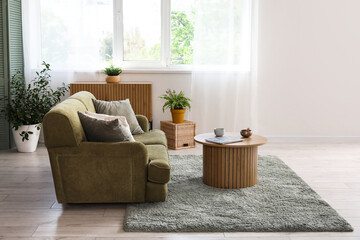 Interior of living room with sofa and Tibetan singing bowl on table