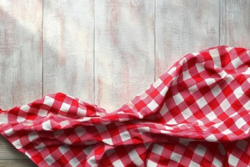 Obraz premium Red and White Gingham Tablecloth on Wooden Table in Kitchen Setting