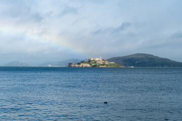Prison of Alcatraz in sunlight with a rainbow on a party sunny day, San Francisco California