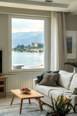 Cozy living room with scenic lake view from large window.