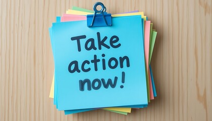 Take Action Now! Motivational Message on Colorful Sticky Notes with a Blue Clip