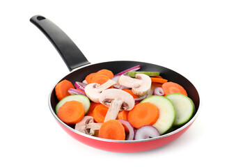 Frying pan with mix of fresh vegetables and mushrooms isolated on white