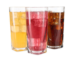 Soda water of different flavors with ice cubes in glasses isolated on white