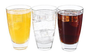 Soda water of different flavors with ice cubes in glasses isolated on white
