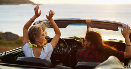 Back, hands raised and road trip with woman friends in convertible for adventure, break or travel...