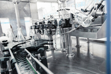 Advanced machinery for bottling beverages in a modern production facility during daylight hours