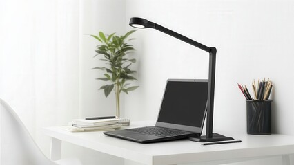 Fototapeta premium Modern Workspace with Laptop, Desk Lamp, and Green Plant