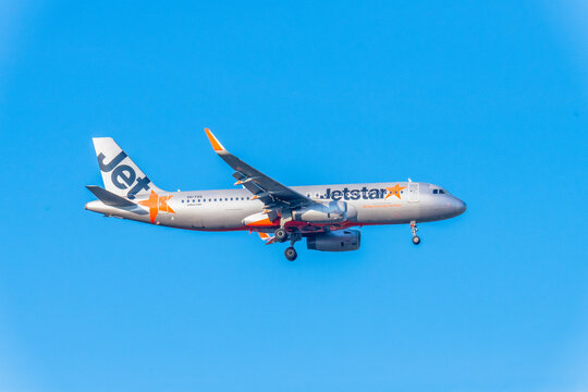 VH-YXQ - Airbus A320-232 - Jetstar Airlines in the light blue afternoon sky