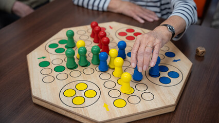 woman in a nursing home playing a board game