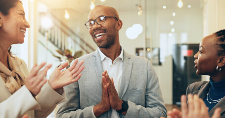 Business people, excited and applause in office for support, positive reinforcement and colleague promotion. Happy man, winner and smile in lobby for career growth, successful campaign or achievement